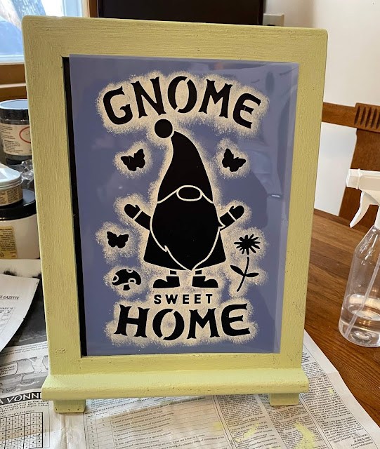 Photo of a gnome home stencil on a chalkboard easel.