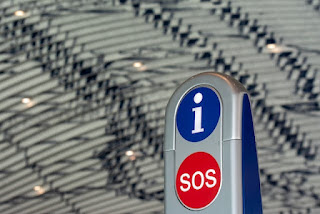 a-parking-meter-with-a-sign-that-says-sos