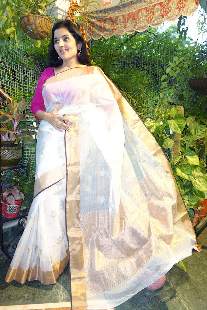 Monochrome Kota Doria saree with rose gold border and pallu.