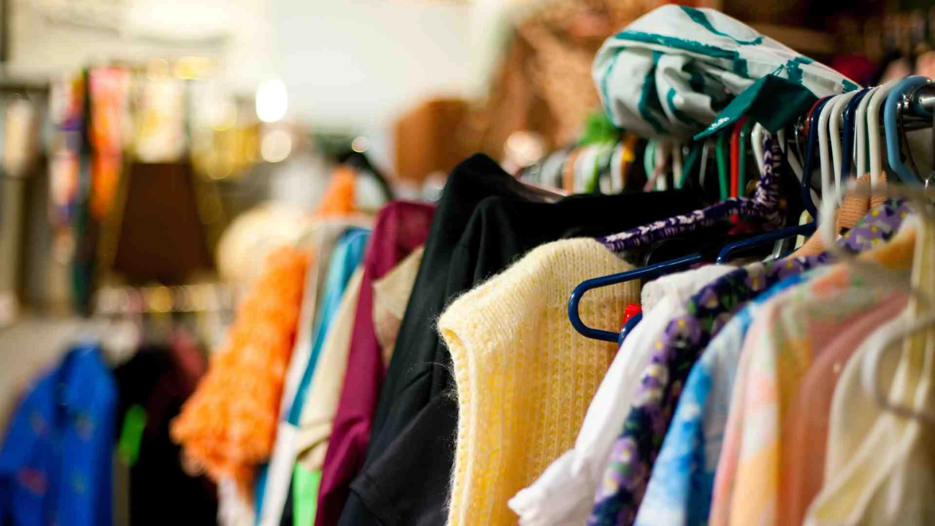 Stock image from Canva pro of a thrift store clothing rail