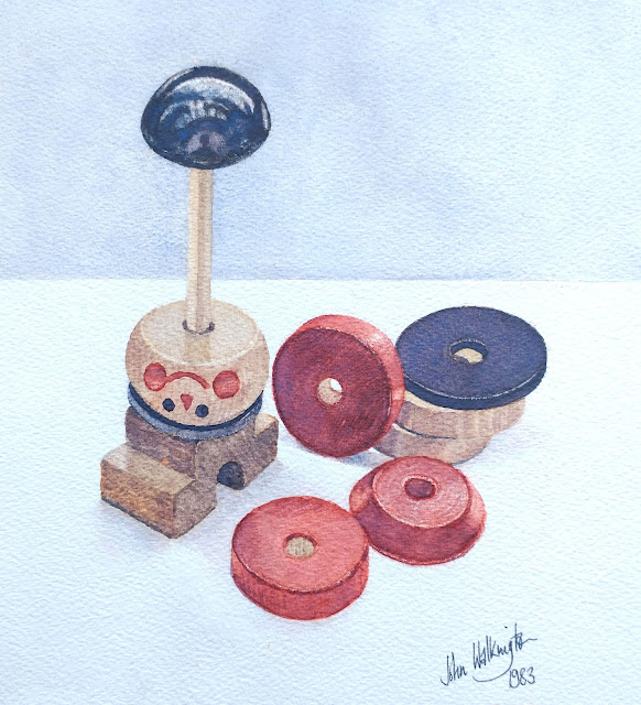 Watercolour still life of a set of gaily painted wooden stacking toys, "Still life with toys," by William Walkington in 1983