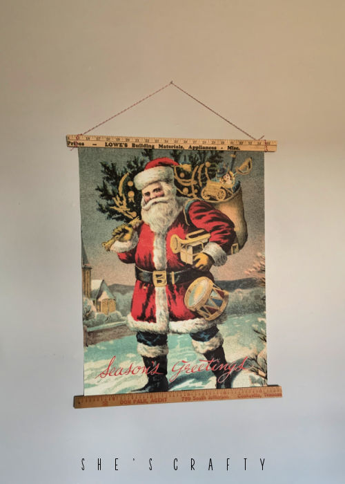 Santa poster art with yard stick poster holder.