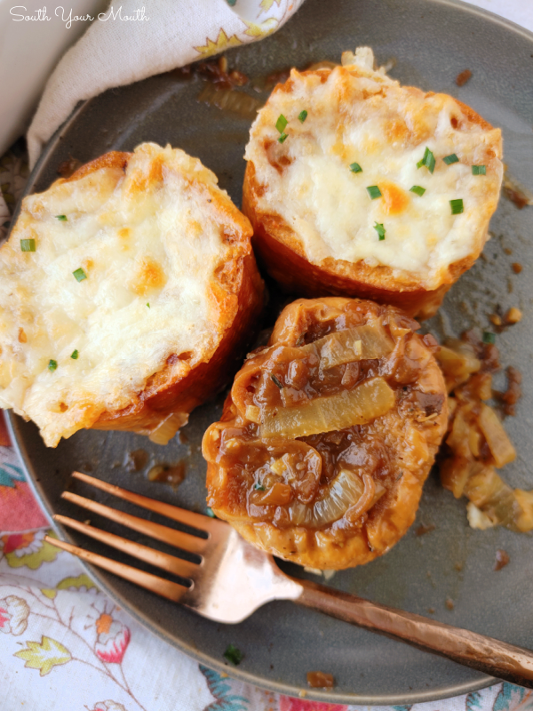 French Onion Soup Casserole! An easy side dish recipe with toasted, crusty bread dipped in a thick French Onion Soup base topped with gooey, buttery melted cheese.