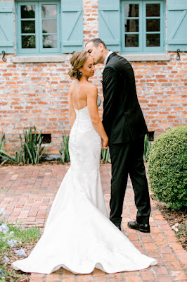 groom kissing brides cheek