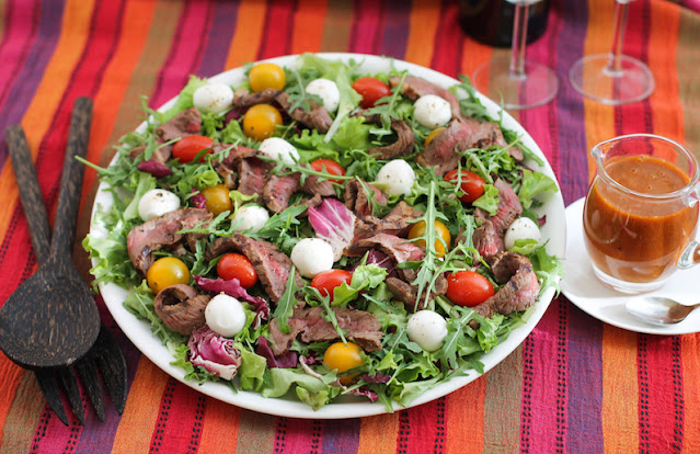 Food Lust People Love: This roasted tomato vinaigrette steak salad sees the vinaigrette do double duty, first as a marinade for the rump steak and then as dressing for the salad itself.