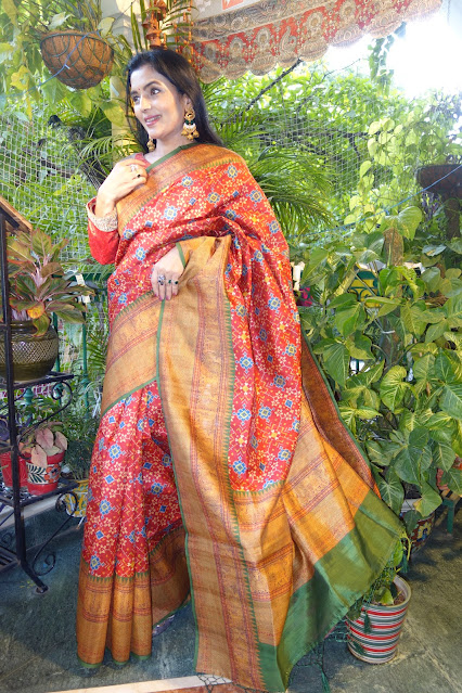 Red silk cotton, digital print Patola Navratan pattern body, and Kanjeewaram like border and pallu.