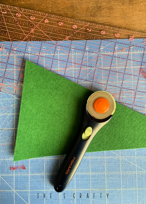 Overhead view of felt cut into flag shape with rotary cutter.