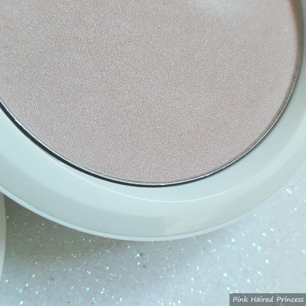 close up of MAC Snowglobe Beauty Powder in compact