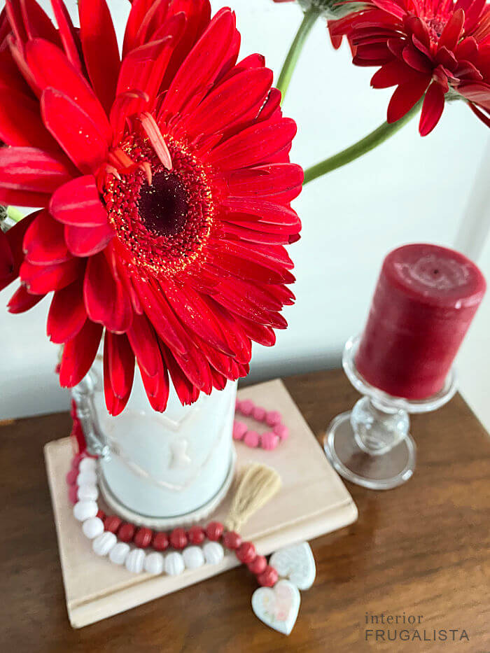 How to turn a vintage terracotta wine cooler from Italy into a romantic hand painted valentine vase with DIY raised stencil lock heart embellishments.