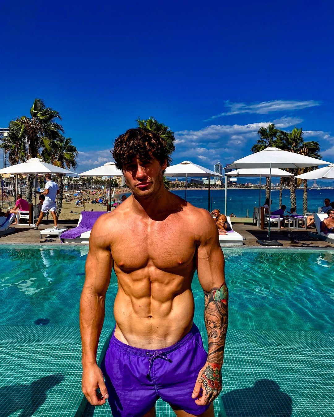 shirtless-sexy-summer-pool-hunk-owen-harrison-abs-curly-hair