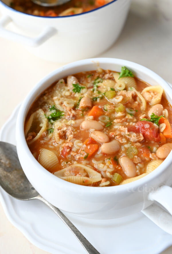 a soup cup with pasta fagioli soup