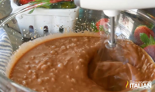 mixing batter for chocolate cupcake recipe