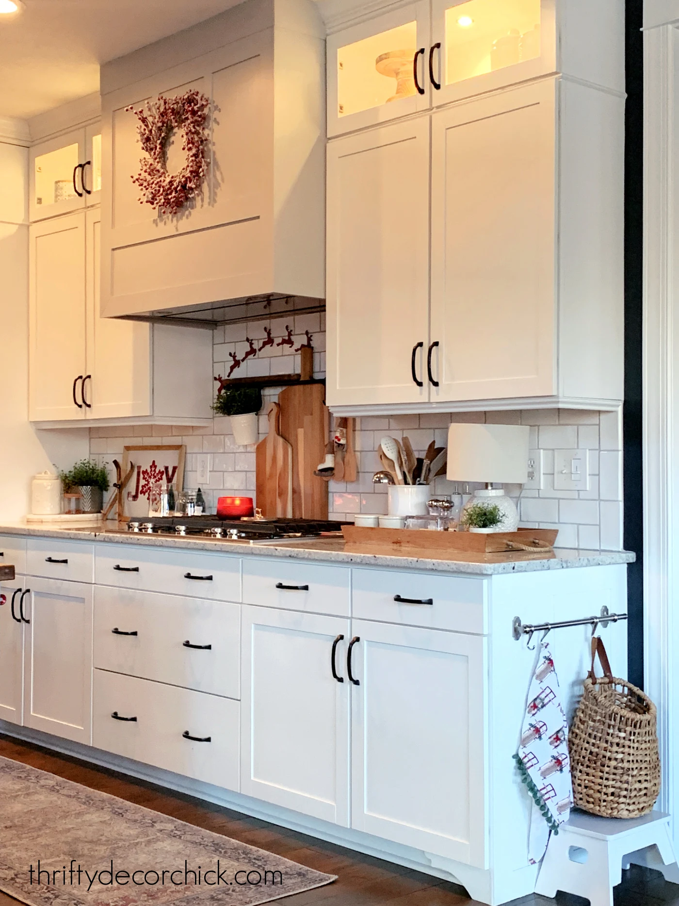 white cabinets and tile black hardware