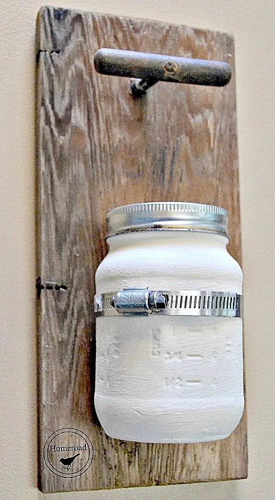 wooden wall hanging and painted mason jar