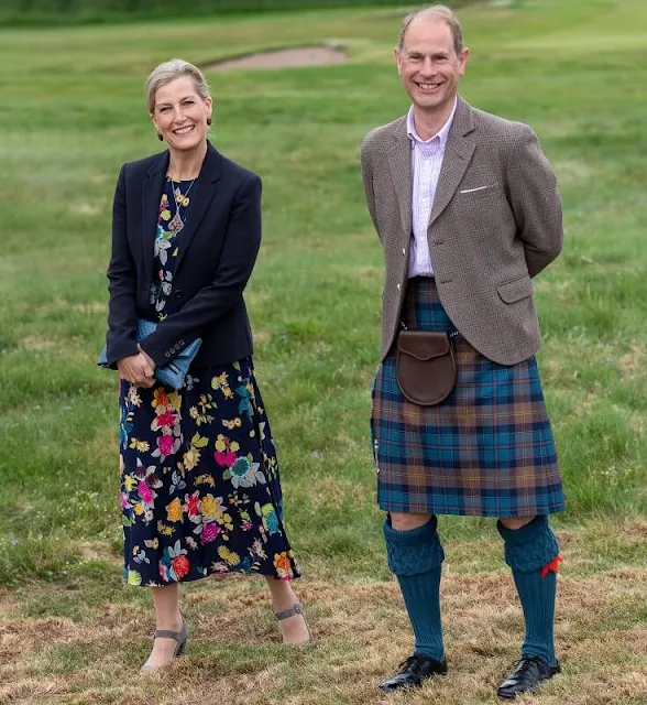 The Countess of Wessex wore a floral stretch silk crepe midi dress from Etro, and blue navy blazer. Prince Edward wore a tartan skirt