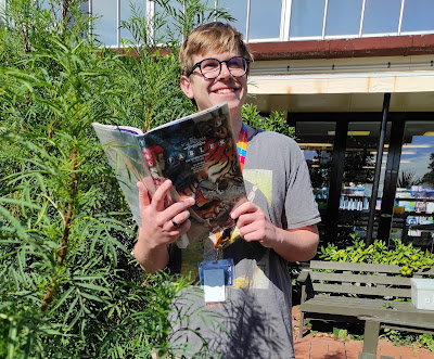 John from Northcote Library holding a book called Fables