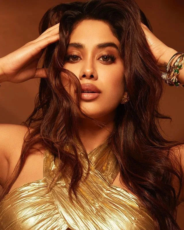 Janhvi Kapoor looks sexy in a short gold, cut-out dress