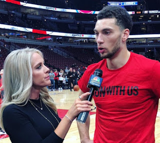 Kelly Crull taking interview with a player