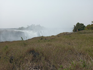 Viewing the Falls from a viewpoint. Notice the mist of spray caused by the waterfalls.