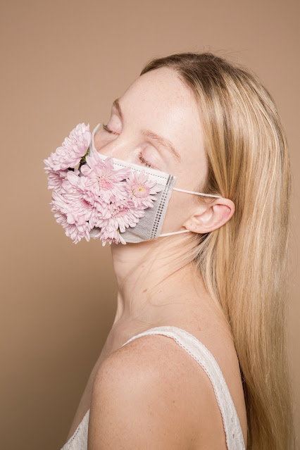 girl wearing a flower mask