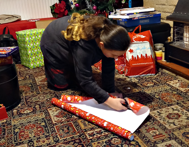 Youngest wrapping presents