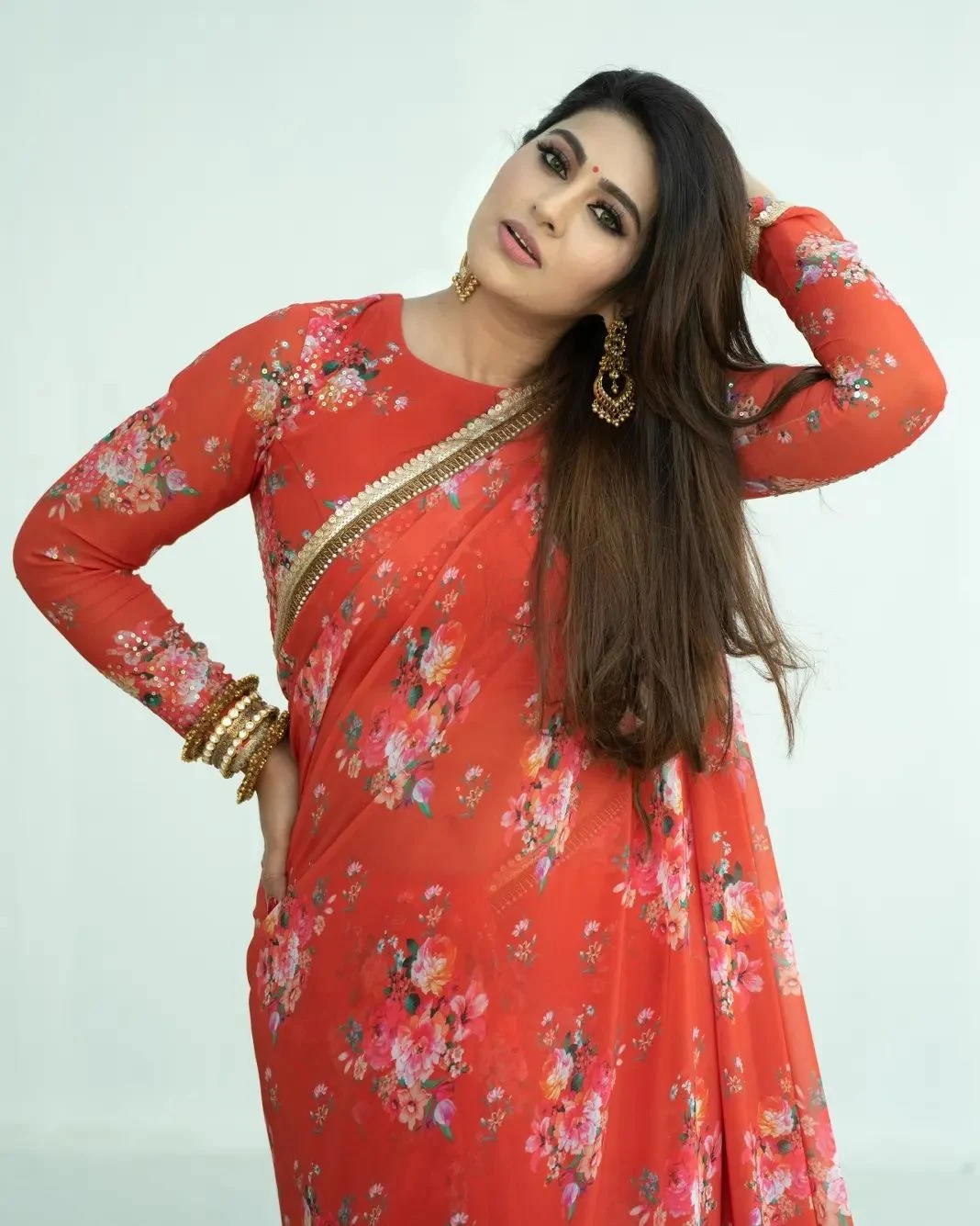 Actress Sneha wearing red floral saree photoshoot