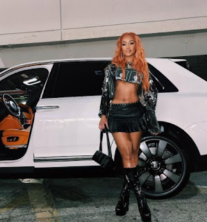 Picture of Saweetie with a car