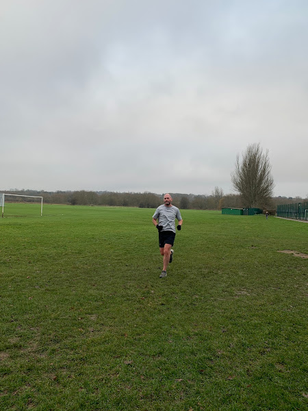 Ian running towards the finish funnel