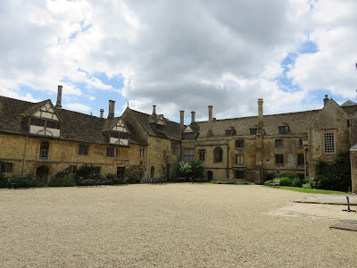 stone and timber frame building with courtyard