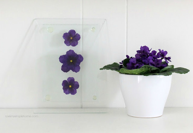 leaning-glass-wall-art-with-faux-flowers-love-my-simple-home