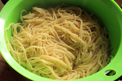 Spaghetti in a colander.