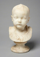 Marble bust of an infant boy, "Head of an Infant," sculpted by Thomas Stuart Burnett (often known as T.S.B.) A.R.S.A. in 1885.