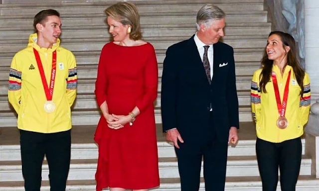 Queen Mathilde wore a red ruffled midi dress from Natan. King Philippe and Queen Mathilde held a reception at the Castle of Laeken