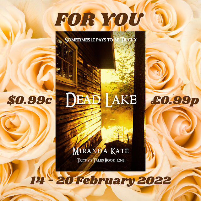 An image of a book cover of Dead Lake by Miranda Kate, which is of the side of a wood cabin overlooking water covered with a yellow filter, set on a background of light yellow roses.