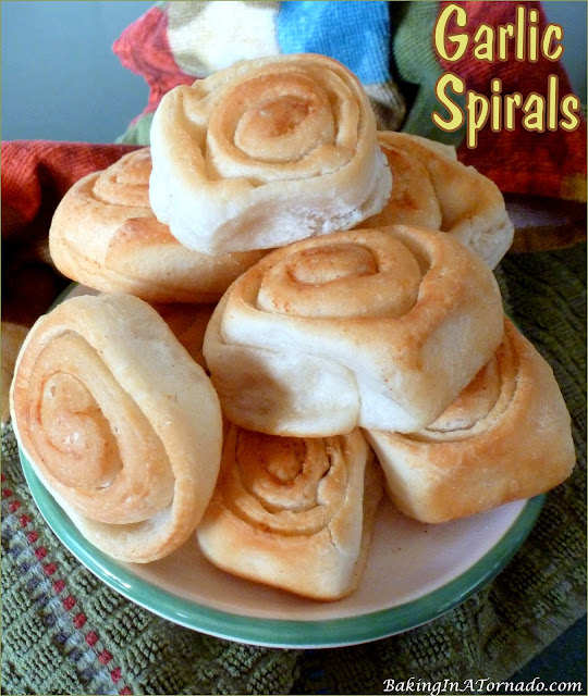 Garlic Spirals are a great accompaniment to any lunch or dinner. | recipe developed by www.BakingInATornado.com | #recipe