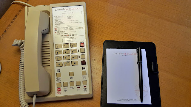 vintage landline telephone and note pad at swissotel the stamford singapore