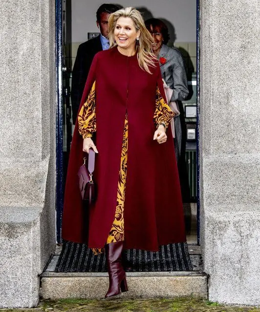 Queen Maxima wore a botanical-print silk maxi dress from Johanna Ortiz, and red wool cape from Natan