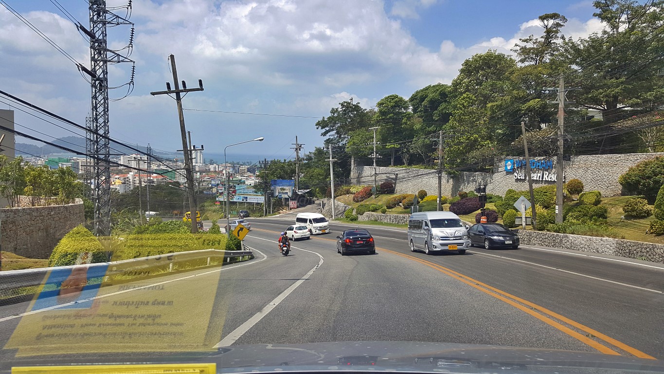 road crossing the mountain into the beach strip of phuket