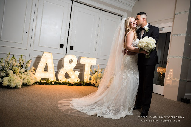 bride and groom kissing with LED lights