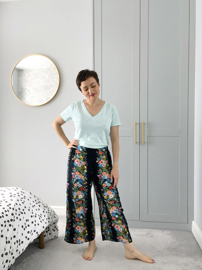 Tilly wearing black culotte trousers with floral print