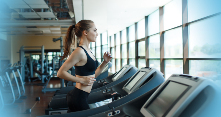 The Importance of Cardio for Weight Loss - a woman is standing on a treadmill