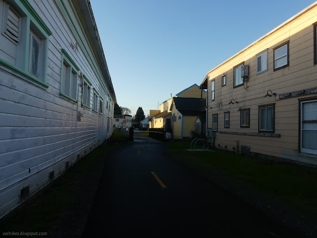 02: paved trail between more blocky buildings