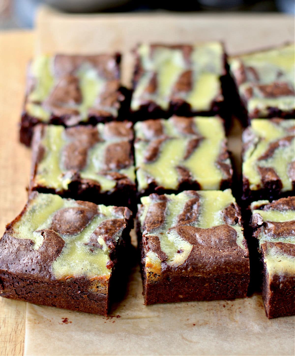 Orange Curd Brownies on cutting board.