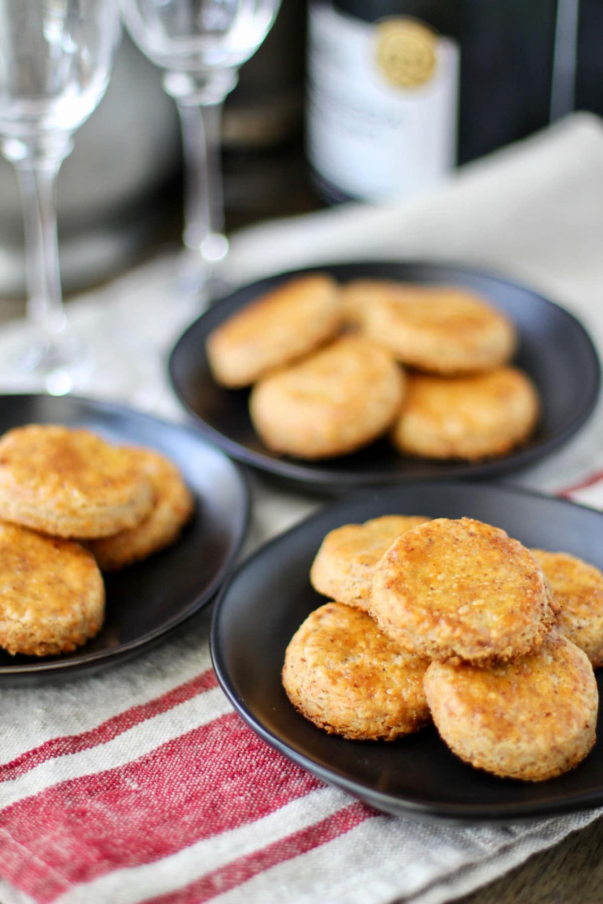 Cheddar Cheese and Pecan Crisps on plates.