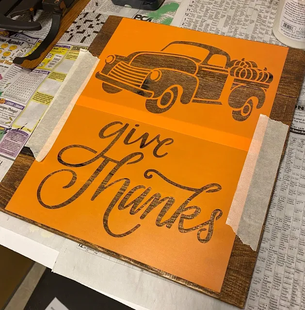 Photo of a Hobby Lobby Fall Truck stencil on a photo holder board.