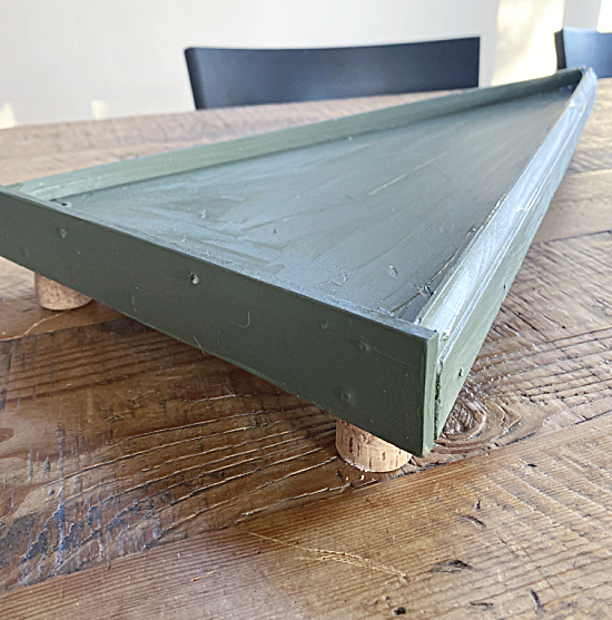 side view of green tree board with legs