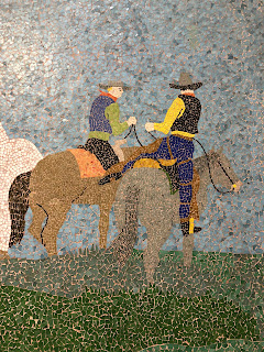 tile mural of cowboys