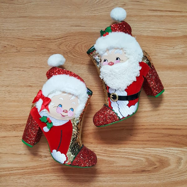 Irregular Choice The Kringles Santa and Mrs Claus boots on wooden floor