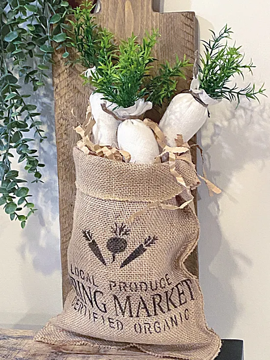 white carrots in burlap bag