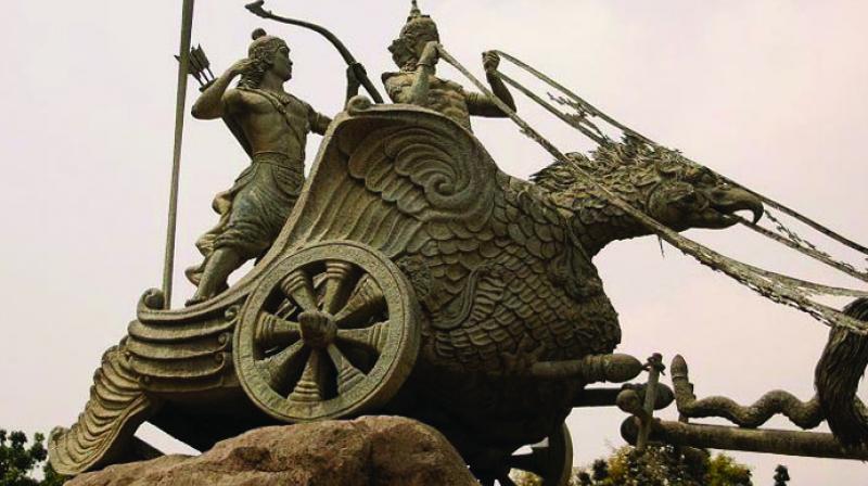 Sculpture of Lord Krishna and Arjuna in a Chariot at a Cross Road in Indonesia